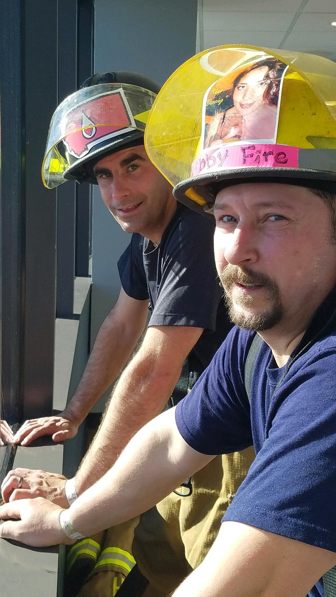 Brian Hobday, left, with Neil Benson stand at the top of the Columbia Center after the stairclimb, March 10 in Seattle. (Courtesy photo)