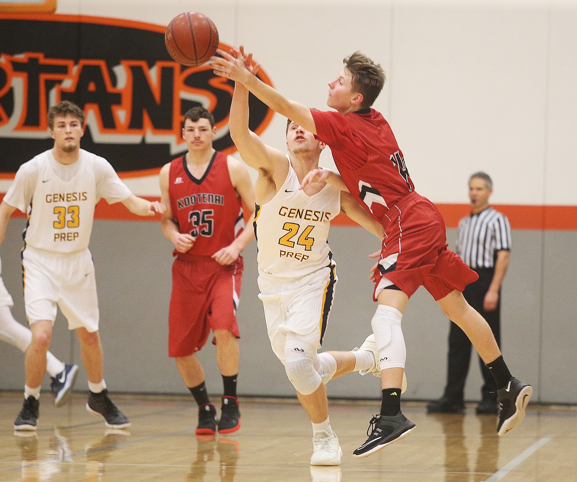 Genesis Prep guard Jonny Hillman and Kootenai&#146;s Jarrett Usdrowski go for a loose ball during a game Feb. 1 at Post Falls Middle School.