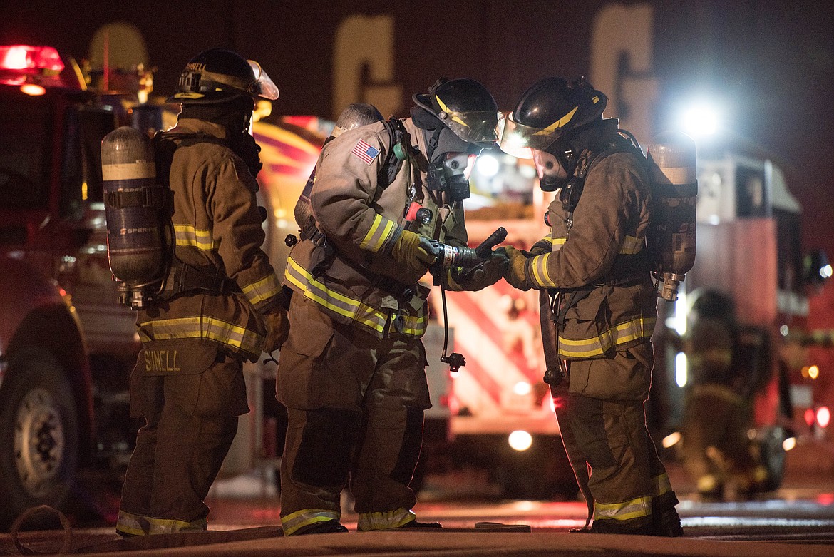 Brian Hobday trains with the Libby Volunteer Fire Department staff Thursday at the Libby High School.