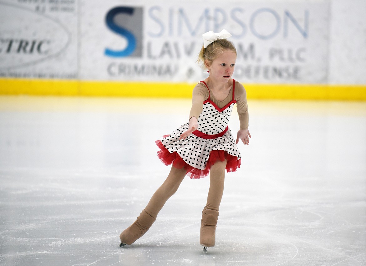 Harper MacIntyre speeds across the ice during a warm-up session Friday afternoon at Stumptown Ice Den. (Heidi Desch/Whitefish Pilot)