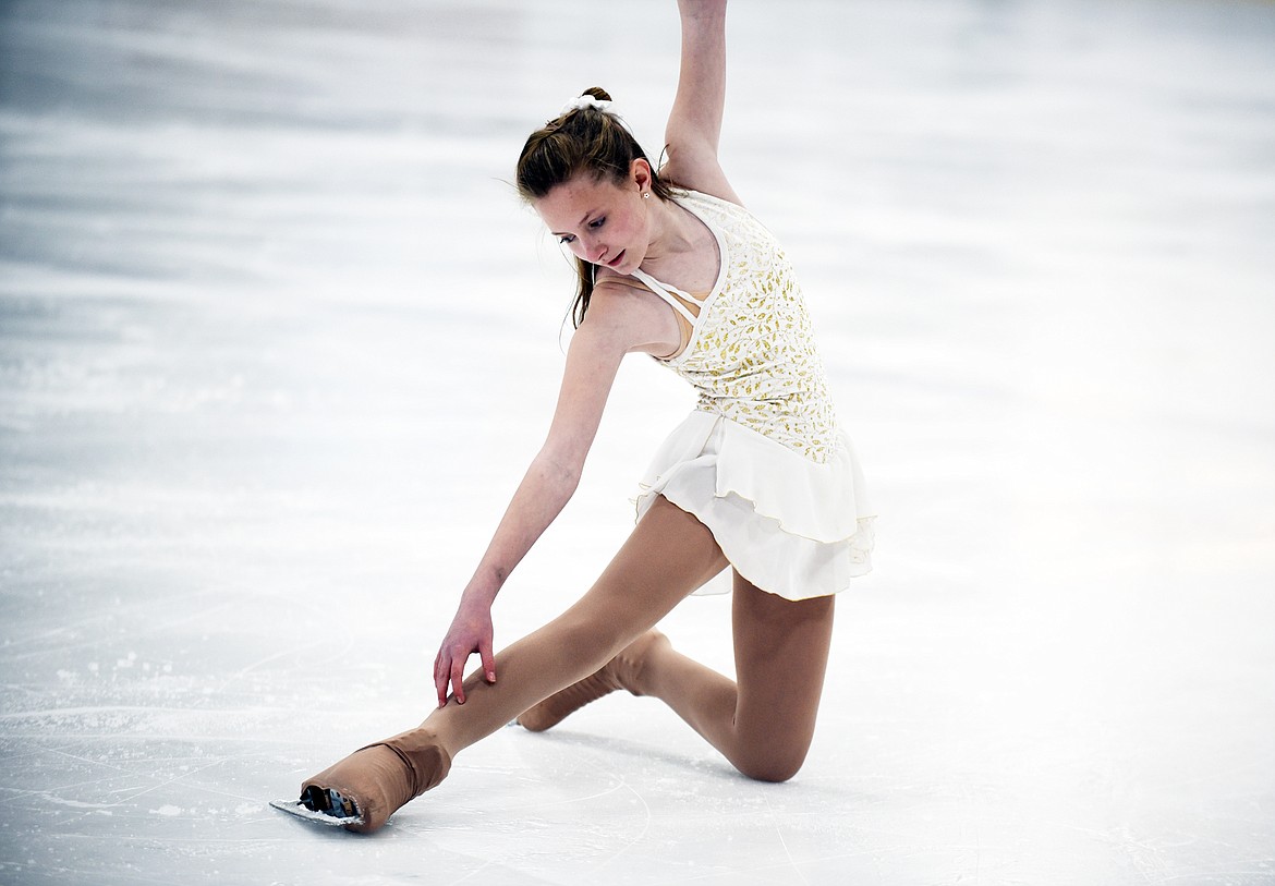 Kaile Jensen strikes a pose on the ice at the end of her routine Friday at the Stumptown Ice Den. (Heidi Desch/Whitefish Pilot)