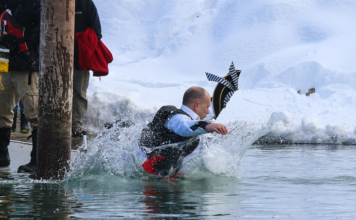 Photo by MANDI BATEMAN
With snow covered banks in the backdrop, the plunge into the river was very chilly.