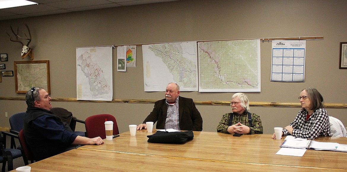 Superior Superintendent Scott Kinney (far left) talks to Rep. Denley Loge on Mar. 5 about challenges facing area schools. They include possibly losing their free hot lunch program. Also at the meeting were John Woodland and Diane Magone (far right). (Kathleen Woodford/Mineral Independent)