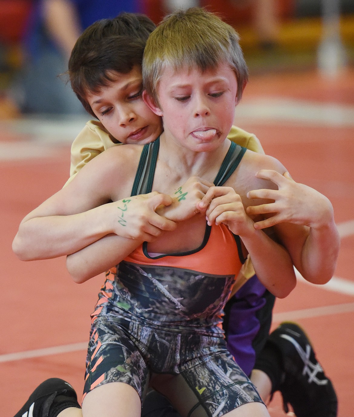 BOONE FORMAN, front, of Mission/Charlo breaks a grip by Polson&#146;s Jayce Hill. Foreman finished first in the class.