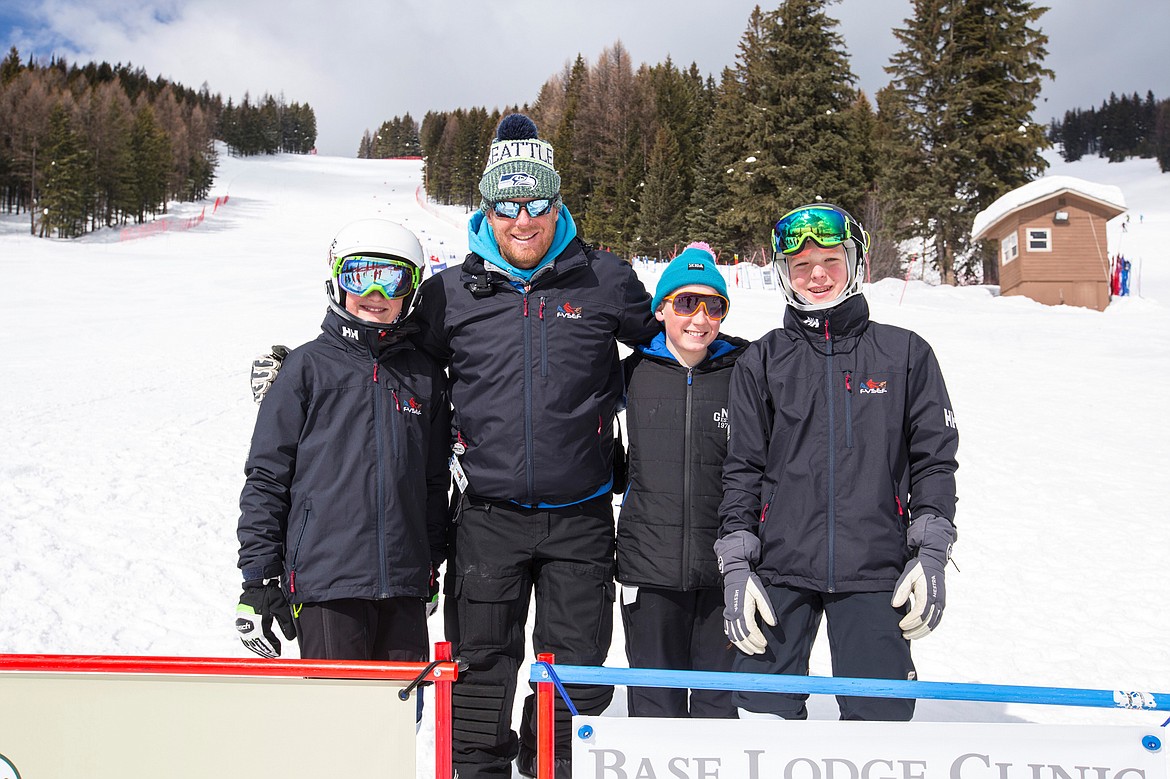 Skiers who will compete at the Western Region U14 Championships in Big Sky, are from left, Wyatt Breck, Coach Jamin Patten, Brodie Kneeland and Christian Lund. (Photo courtesy Craig Moore/GlacierWorld.com)