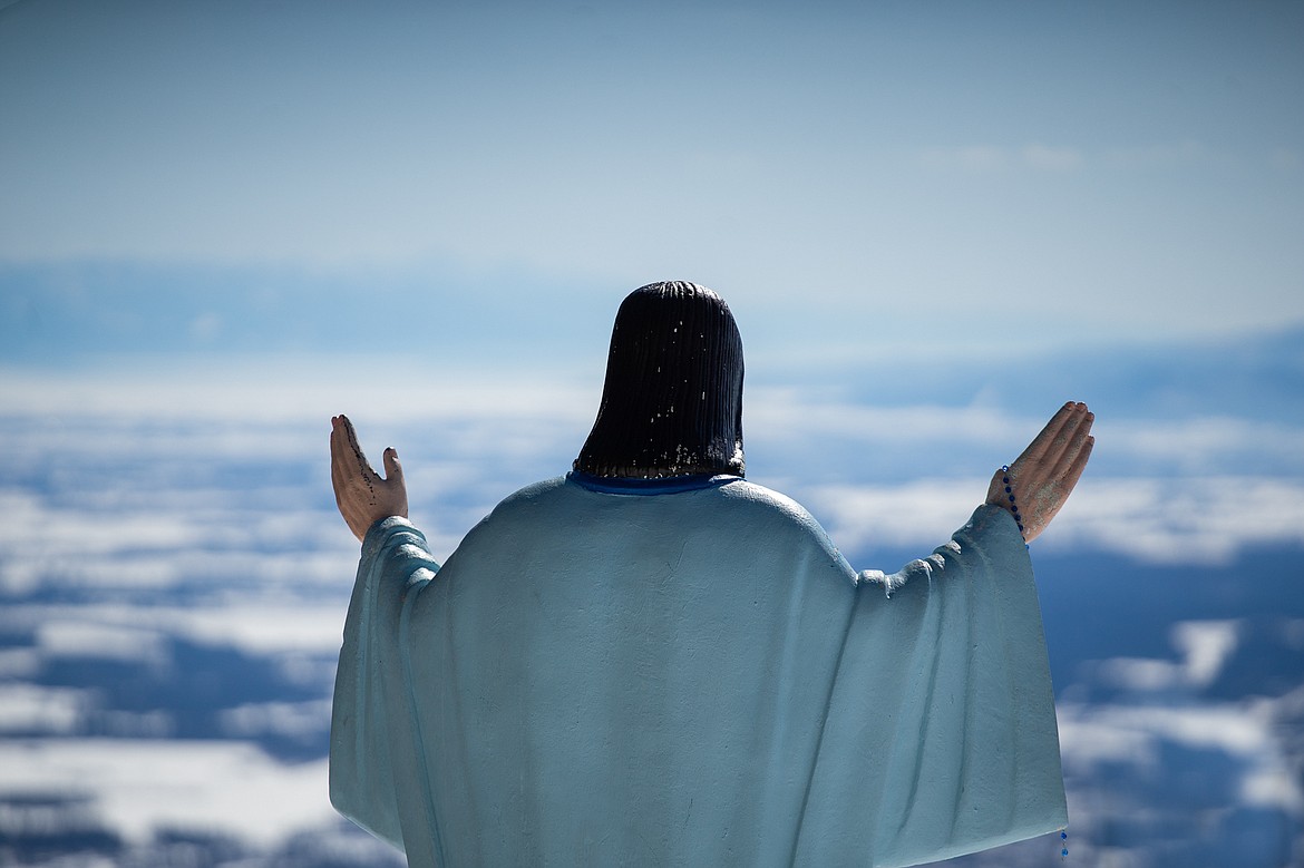 The Jesus statue near Chair 2 looks out over a great day of spring skiing on Sunday at Whitefish Mountain Resort. (Daniel McKay/Whitefish Pilot)