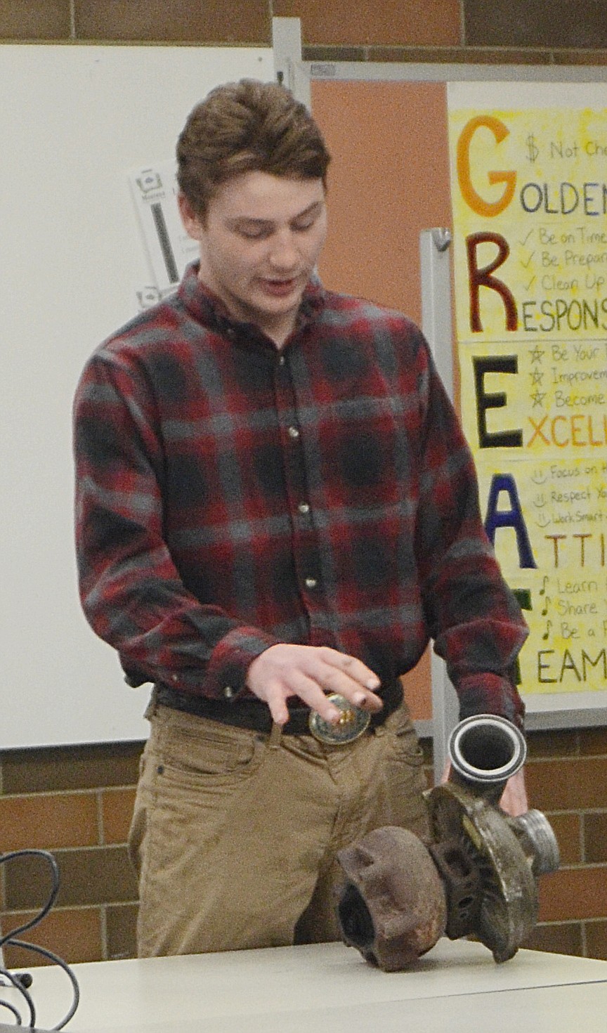 DANE CHOJNACKY of Trout Creek shows how to &#147;Rebuild a Turbo&#148; during 4-H Competition Days preliminaries in Thompson Falls last weekend.