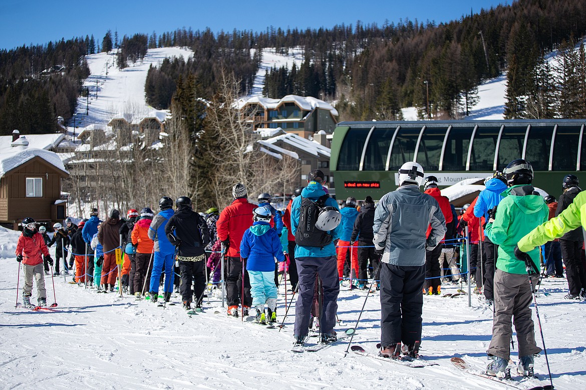 Eager skiers wait for a ride to the summit on Sunday at Whitefish Mountain Resort. (Daniel McKay/Whitefish Pilot)