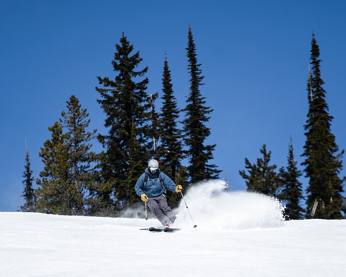 A skier sprays powder on Ed's Run on Sunday at Whitefish Mountain Resort. (Daniel McKay/Whitefish Pilot)