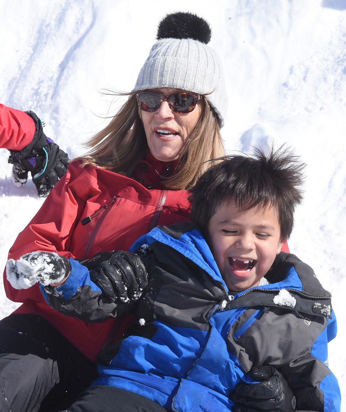 FIRST-GRADE teacher Pam McCrumb became &#147;one of the kids&#148; at Cherry Valley Elementary School while sliding down a mountain of snow with DJ Pierre during recess last Friday.