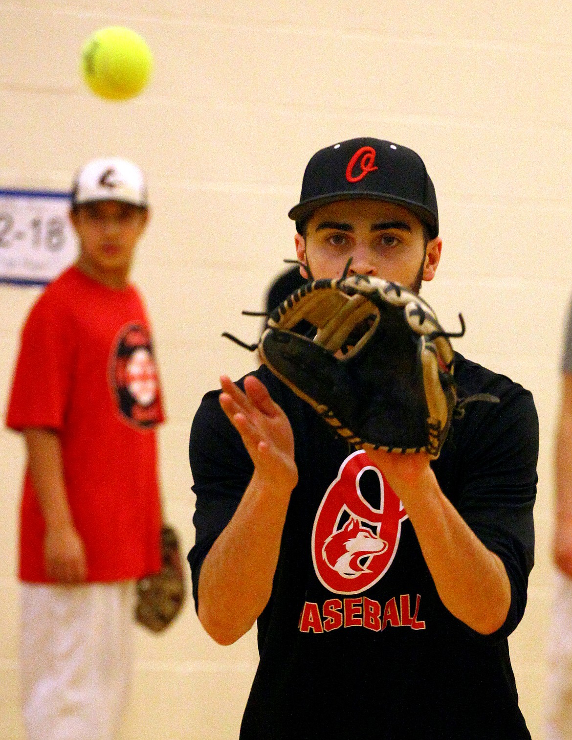 Rodney Harwood/Sun TribuneOthello shortstop Jonathan Garza takes the throw at second base during a double play drill in the gym Wednesday afternoon.