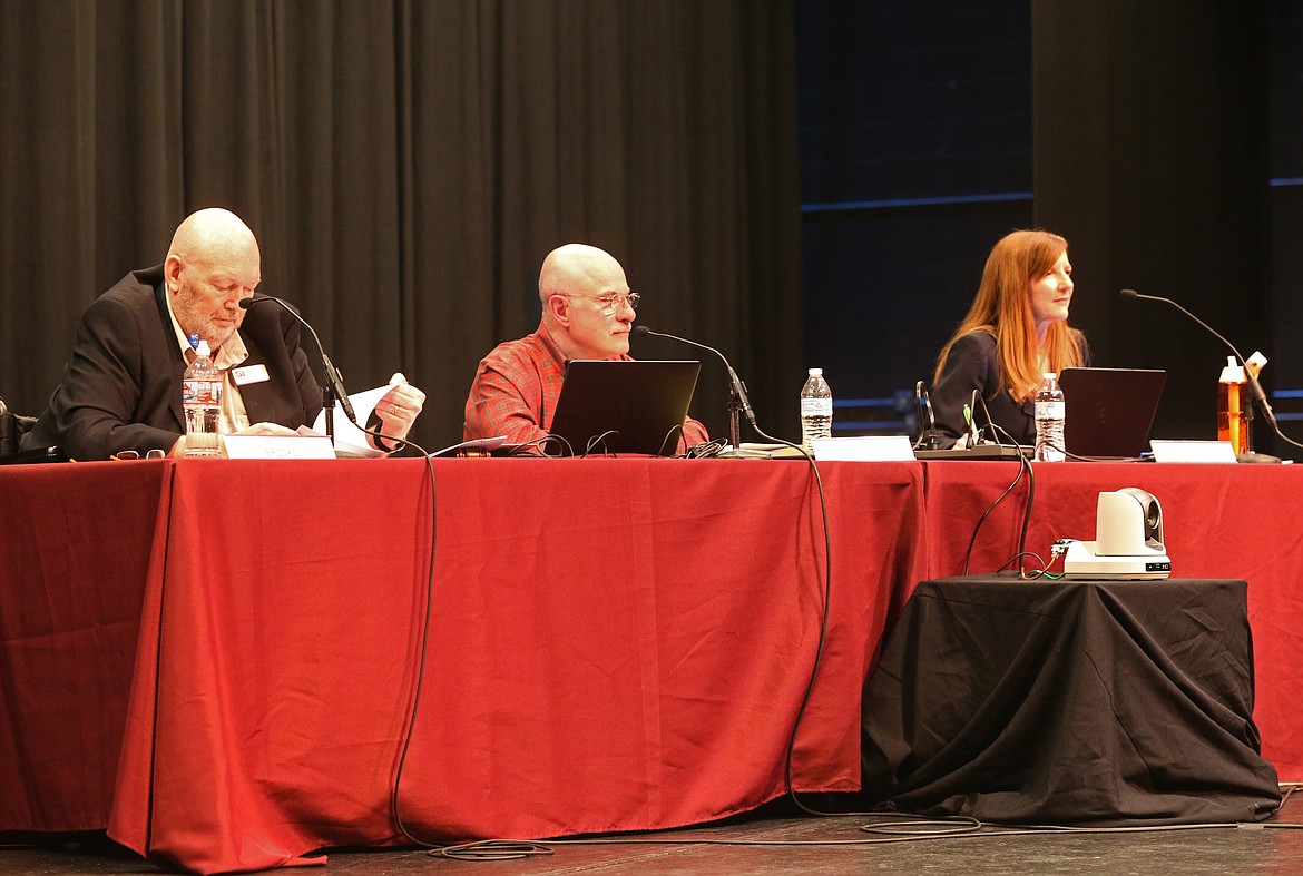 From left, Kootenai County Commissioners Bill Brooks, Chris Fillios and Leslie Duncan listen to personal testimonies during Thursday's building codes public hearing at North Idaho College. (LOREN BENOIT/Press)