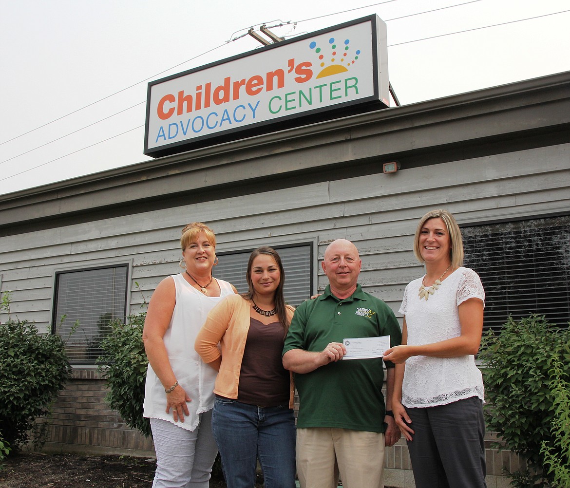 Courtesy photo
Sheriff Ben Wolfinger presents a check for $23,000 to Safe Passage on Aug. 8, 2017. The funds, from the county&#146;s drug asset forfeiture account, were used to help pay for the Children&#146;s Advocacy Center&#146;s operating costs. From left: Michelle Manteuffel, family advocate at the CAC; Tamarah Cardwell, CAC director; Wolfinger; and Chauntelle Lieske, Safe Passage executive director.