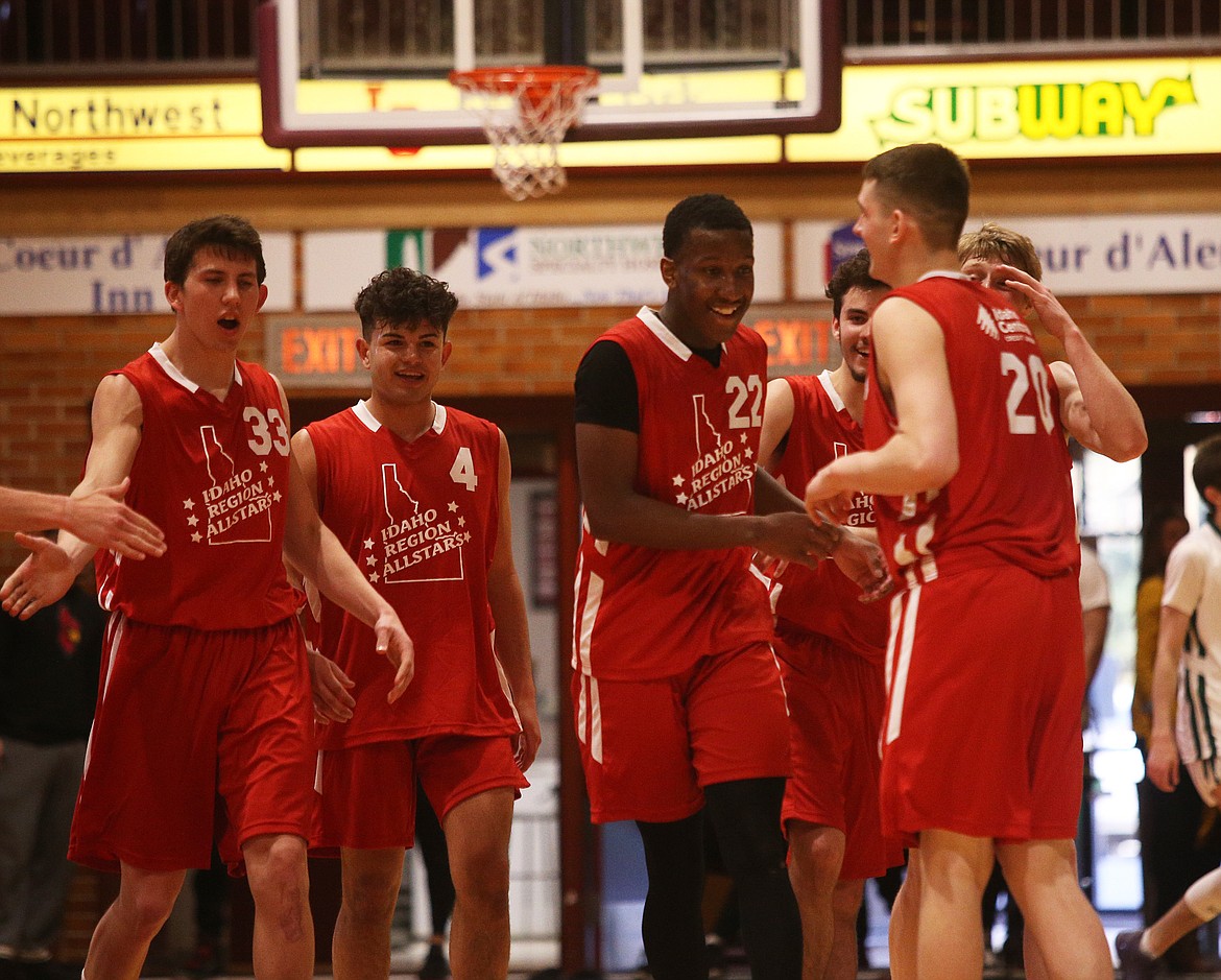 Region All-Star Jarod Adams (22) of Mountain Home is congratulated after blocking an opponent&#146;s layup in the final seconds of Saturday&#146;s Idaho high school all-star boys basketball game at NIC.