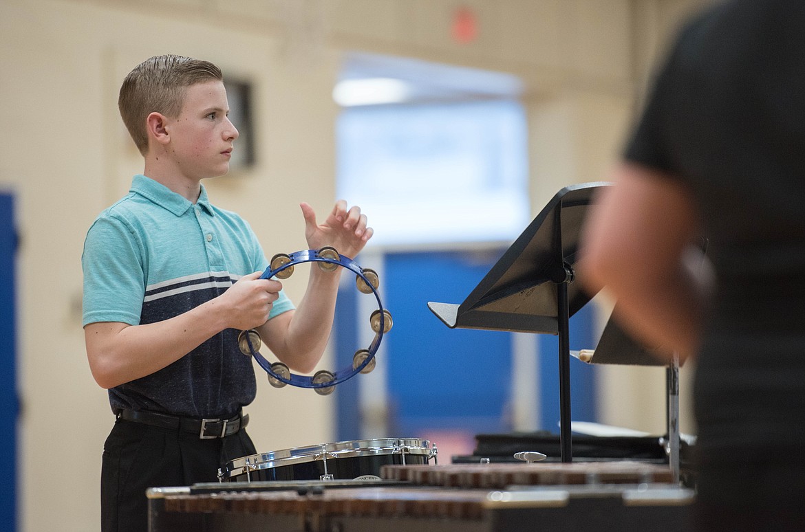 Greysen Thompson helps keep the rhythm at a concert, Friday at the Ralph Tate Memorial Gym in Libby. (Luke Hollister/The Western News)