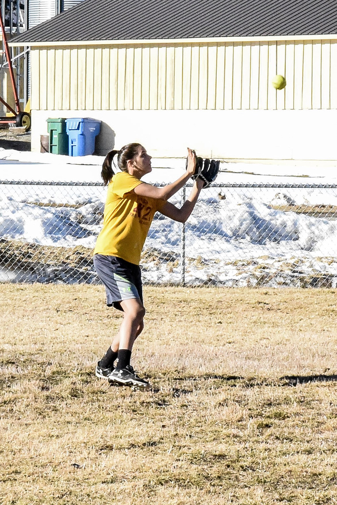 Troy sophomore Talise Becquart makes a catch during fielding practice at the Troy practice field March 18. (Ben Kibbey/The Western News)