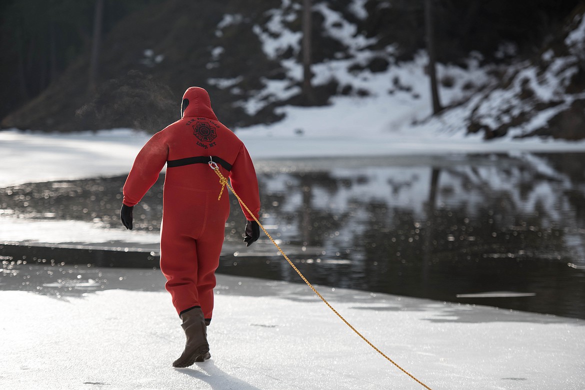 Luke Miller prepares to jump in Throop Lake during a seasonal rescue training exercise for David Thompson Search and Rescue crew members, Saturday at Throop Lake. (Luke Hollister/The Western News)