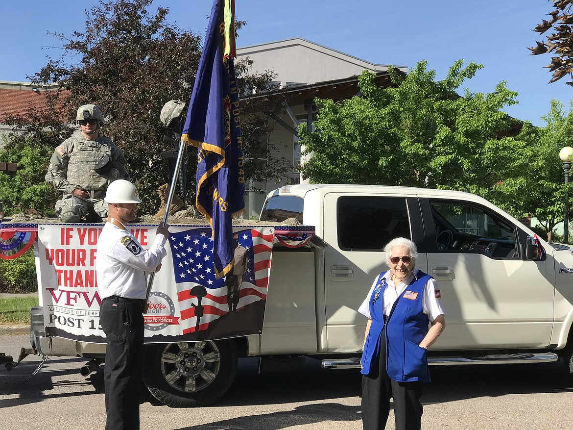Stella Sharp gets ready for the Memorial Day parade in Libby last year. Though she doesn't carry the flag any more, at 93 Stella continues to be active with the VFW Post 1548 Honor Guard. (Courtesy photo)