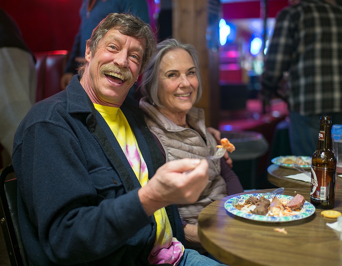 Dan Danner and Alice Infelise enjoy the free wild game feed at the Blue Moon last week.