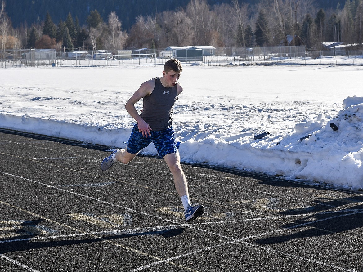 Libby sophomore Jay Beagle takes a final stride during a 100 meter time trial March 19. (Ben Kibbey/The Western News)