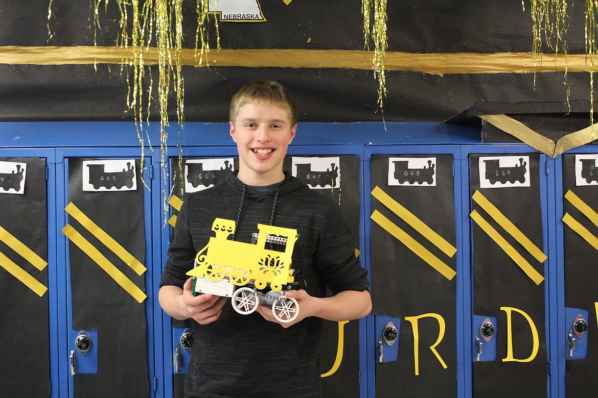 Brycen Cowlin shows his school spirit as he holds a functioning train to represent Purdue&#146;s mascot, the Boilermaker Special.