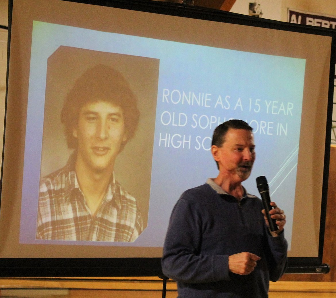 SEVEN-TIME oral cancer survivor Ronnie Trentham shows Mineral County high school students a photo of himself as a sophomore when he started to use chewing tobacco. The presentation was a part of &#147;Kick Butts&#148; day on March 21. (Kathleen Woodford/Mineral Independent)