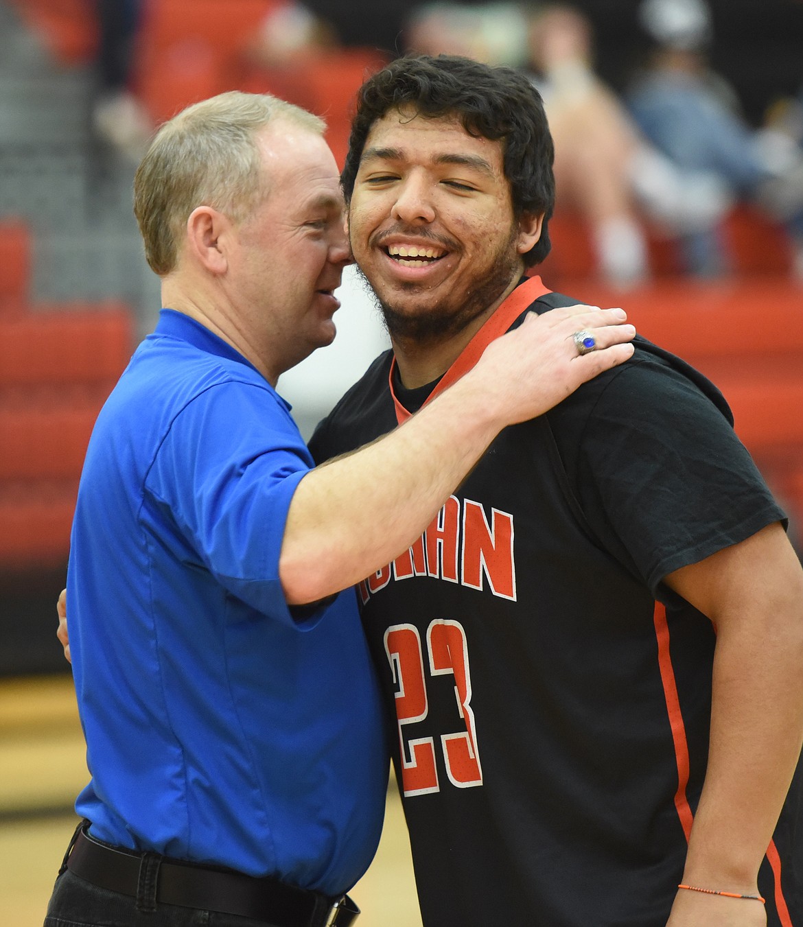 BUBBA BUSH of Ronan gets congratulations from Steve Woll after Bush won the boys' version of the Les Rice Memorial 3-point Shootout during Mission Valley All-Star Game events.