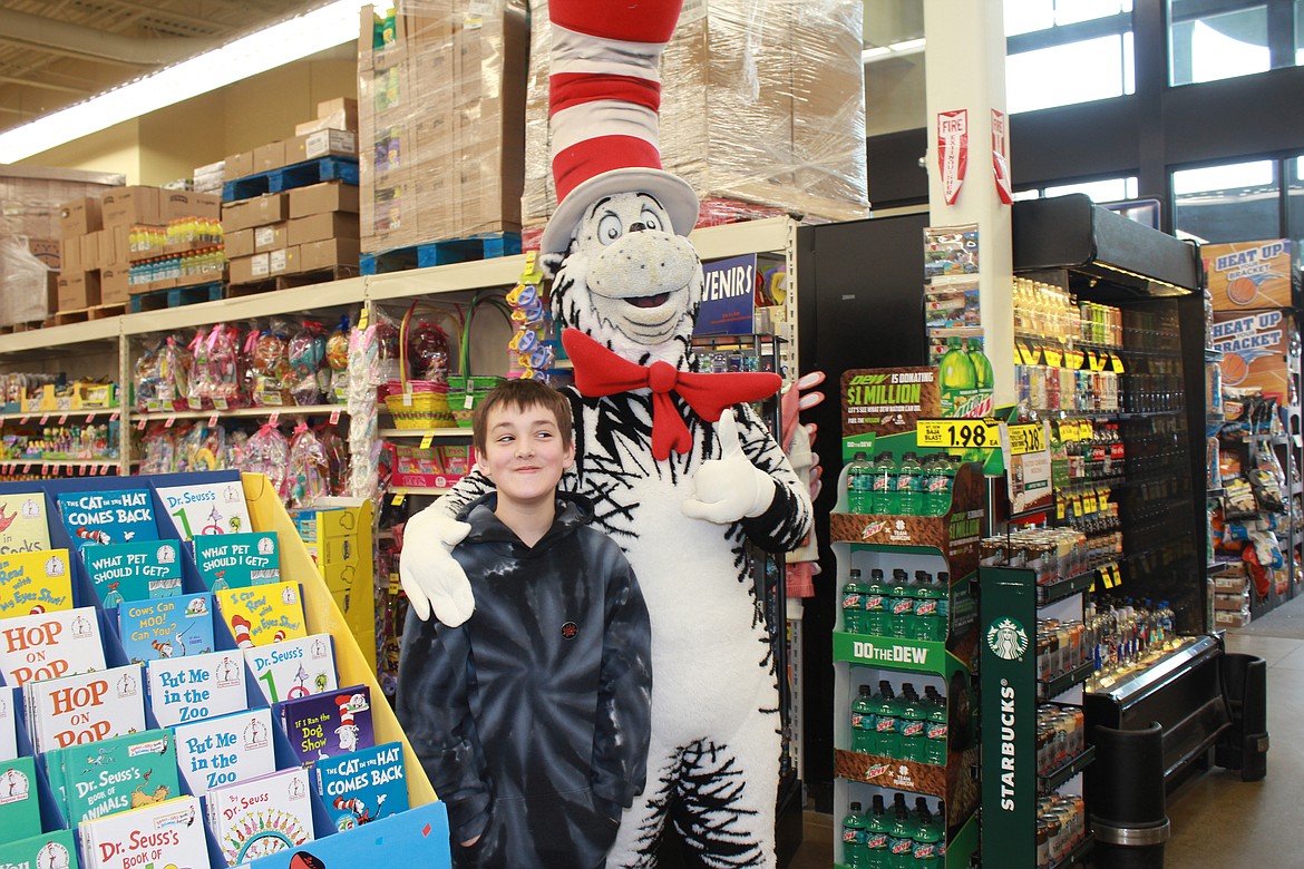 Photo by TANNA YEOUMANS
Gabriel Walkup gives his mom a look as he poses with the Cat in the Hat during his March 16 appearance at Super 1 Foods.