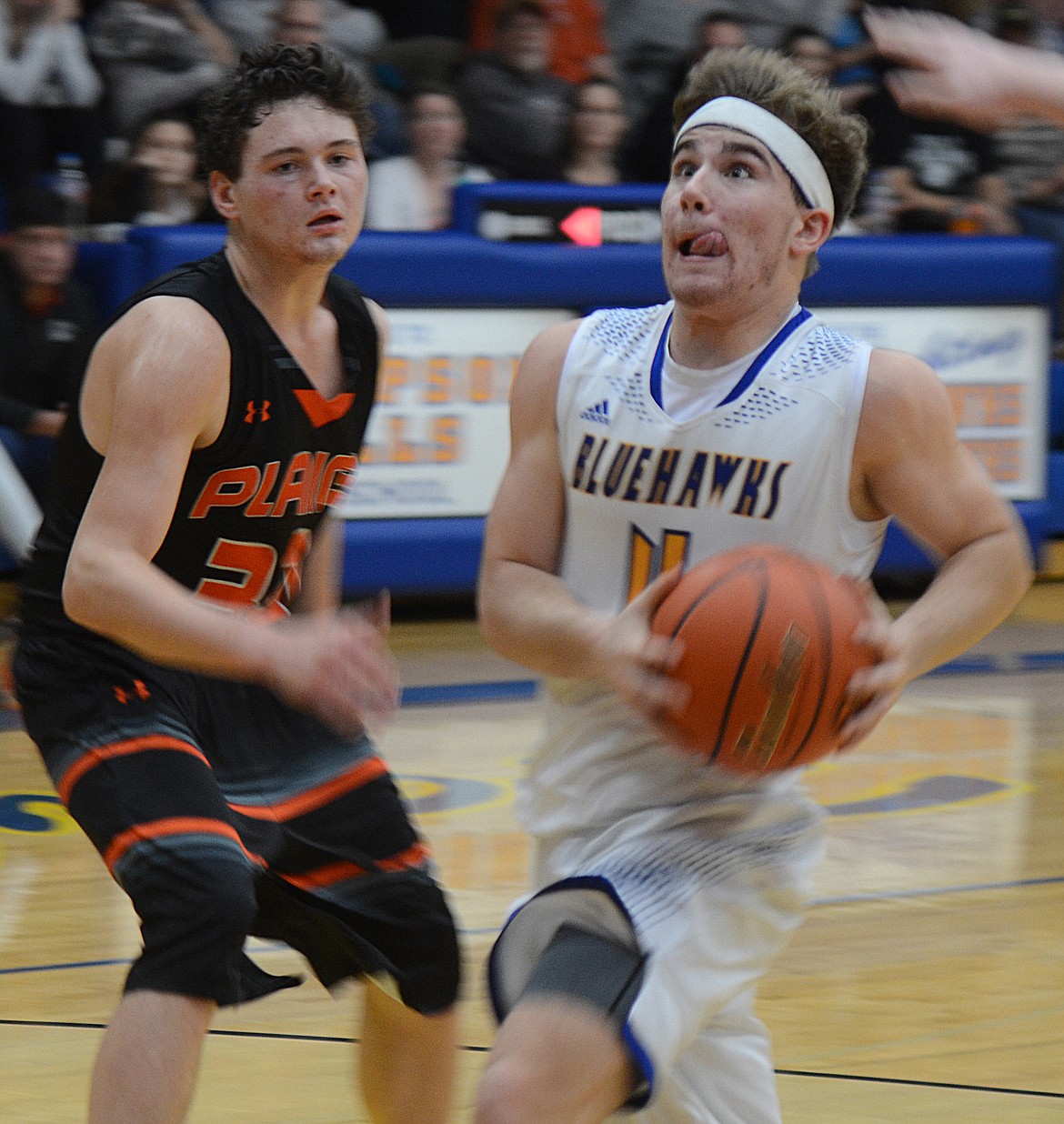 THOMPSON FALLS junior Ryan Schraeder, taking the ball to the hoop past Matt McCracken of Plains, was named to the District 7B all-conference team for the 2018-19 season. His freshman brother Nathan was elected to the all-conference second team. (Joe Sova/Clark Fork Valley Press)