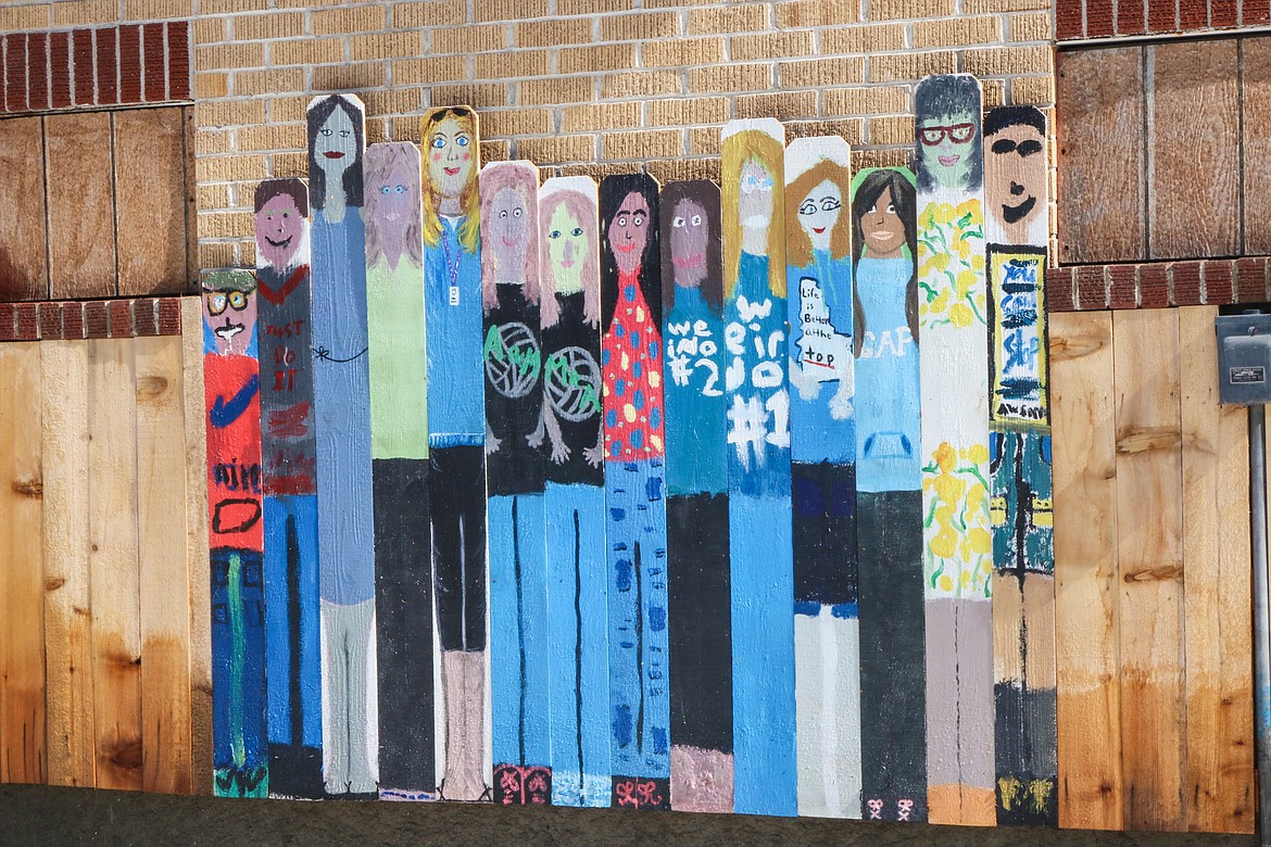 Photo by MANDI BATEMAN
The happy fence adds beauty to the walls of the old school.