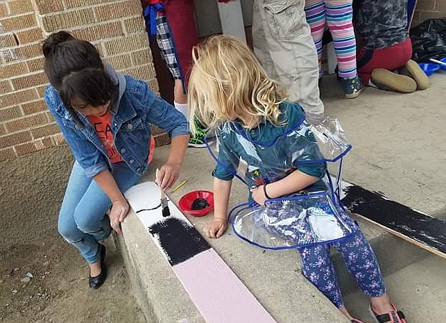 (Courtesy Photo)
The older students paired up with younger students to help them with their boards.