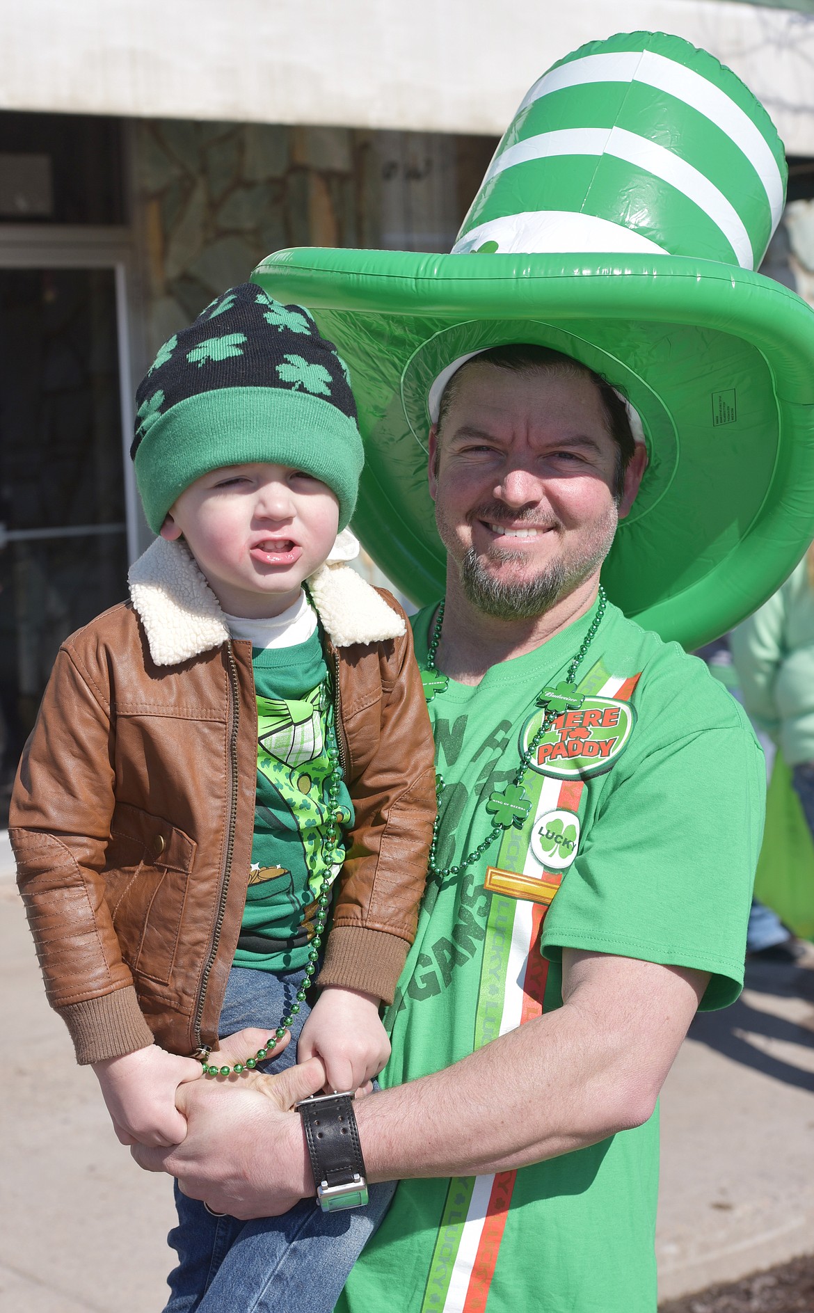 THE CIRAFICE family members of Polson were decked out in Irish garb to watch the St. Patrick's Day Parade. Pictured are Matt and his 3-year-old son, Nolan.