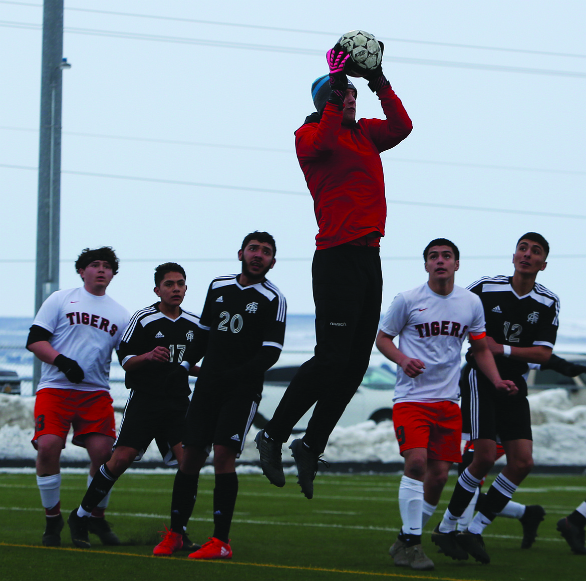 Connor Vanderweyst/Sun Tribune
Ephrata goalie Josh Benthem jumps to catch a corner kick against Royal.