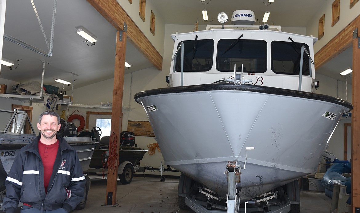 THE BOAT that built a fire station - Eric Anderson shows how the needs of the U.S. Biological Station and of the Yellow Bay substation of the Finley Point/Yellow Bay Fire Department could all be met.