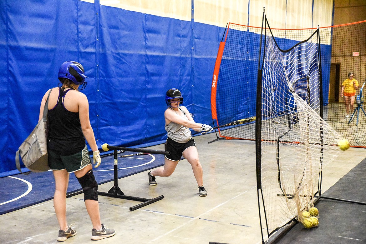 Libby juniors Amaya Borden and Sheila Gallagher practice hitting in the Ralph Tate Memorial Gym Tuesday. (Ben Kibbey/The Western News)