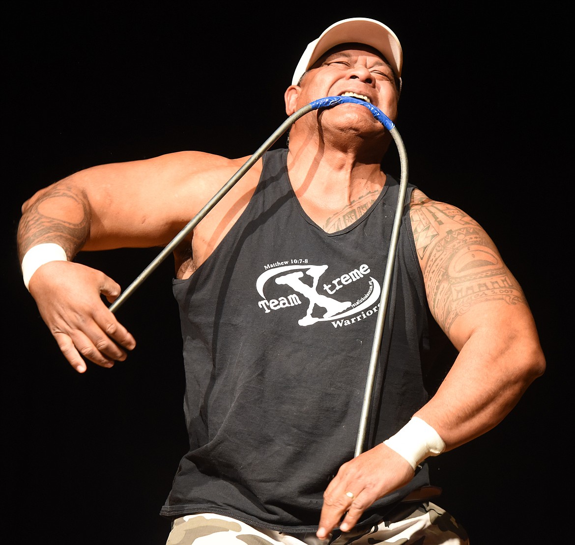 TUA MEAFUA of Team Xtreme uses his teeth and bare hands to bend a piece of rebar during Mission Valley Has Talent.  Meafua and Tile Falkner performed &#147;Feats of Strength&#148; win the Adult division title.