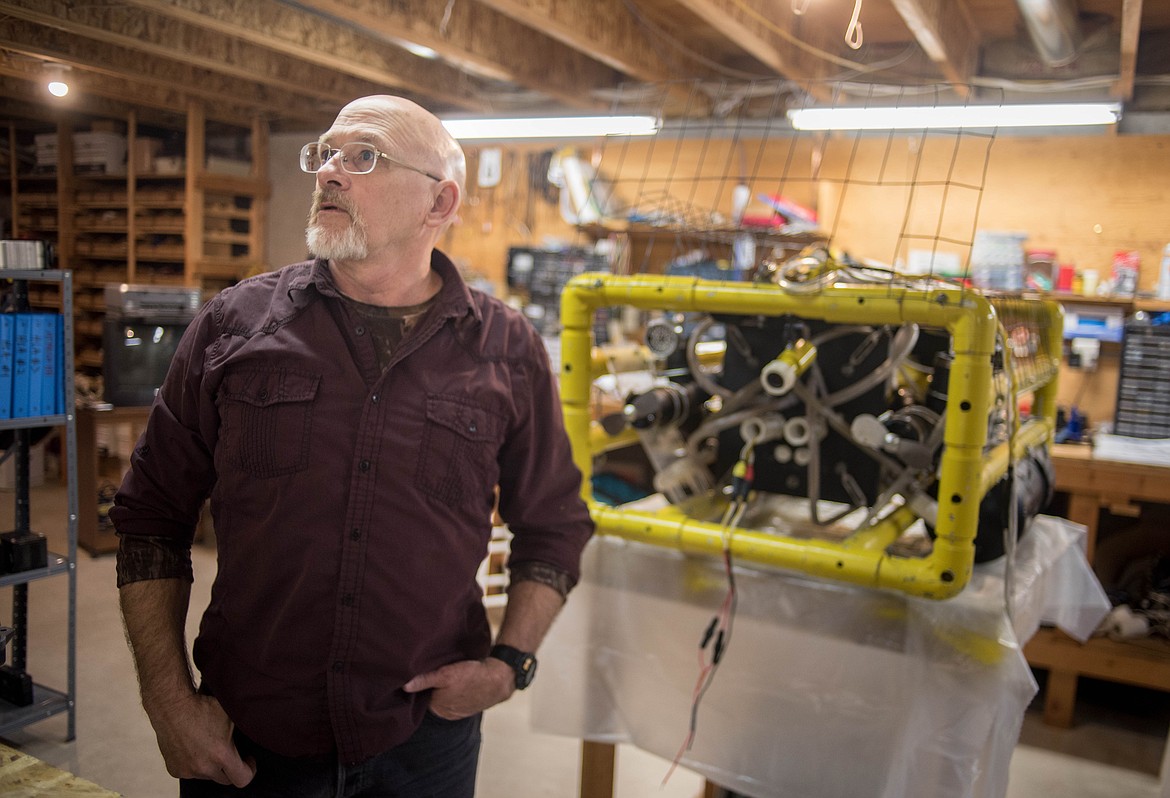 Bob Hosea talks about his remote-operated submarine, sitting by him, March 12 in Libby. (Luke Hollister/The Western News)