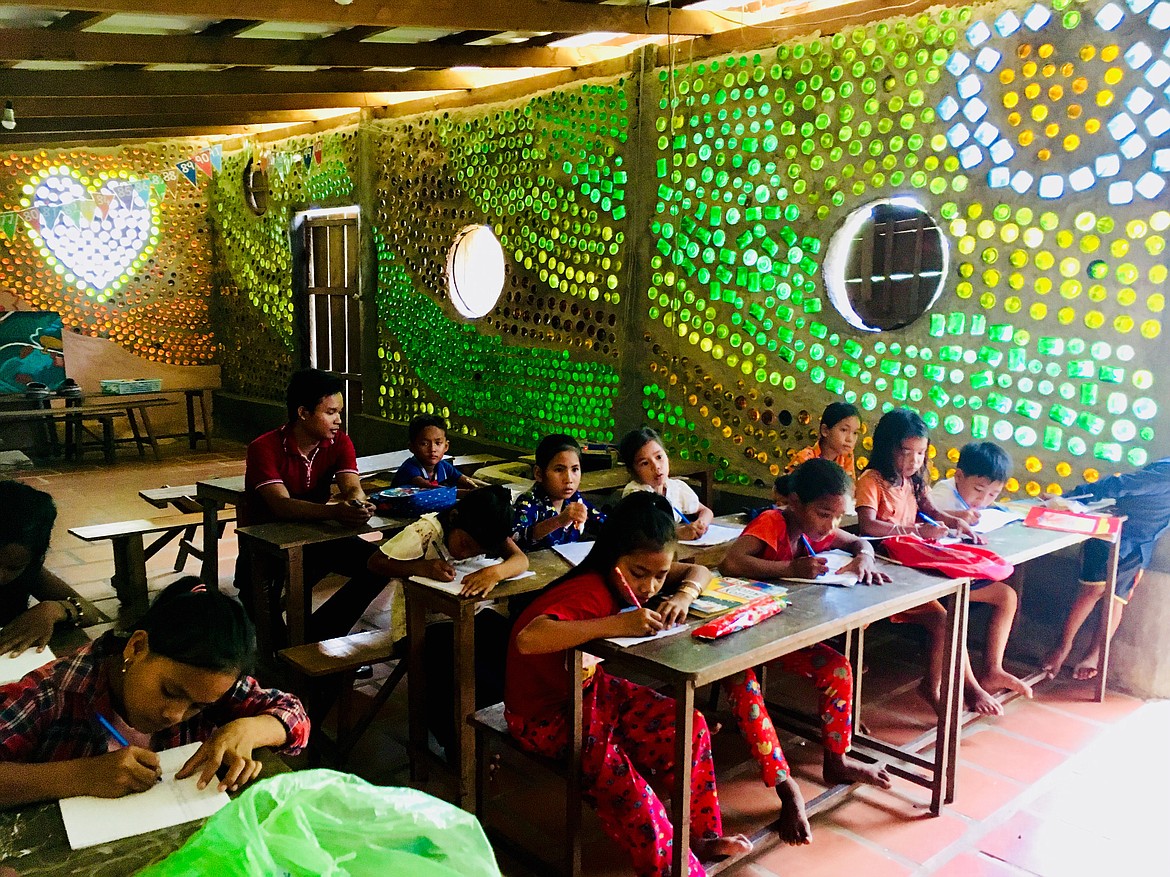 Cambodian students are shown in the Red Road Foundation&#146;s school in Kampot built with recycled glass bottles.