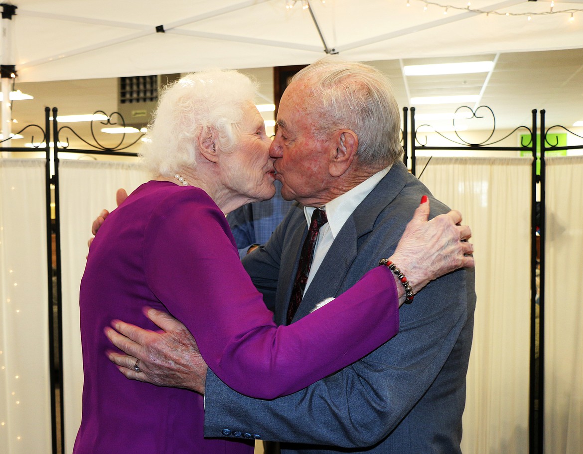 (Photo by CAROLINE LOBSINGER)
Doris and Glenn Hescock seal their marriage vows with a kiss after getting married Thursday at Sandpoint Furniture in Ponderay. The couple had visited the store looking for furniture the week before and a conversation about their upcoming wedding led the store to offer to host the ceremony.