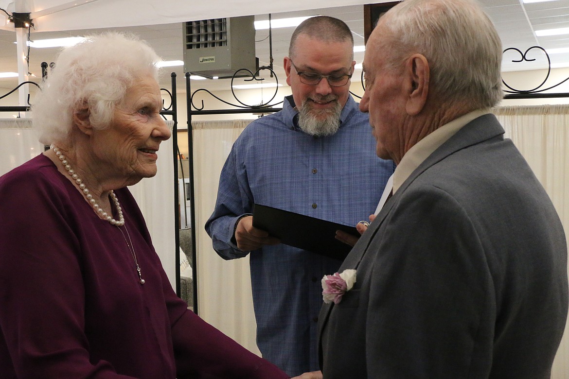 (Photo by CAROLINE LOBSINGER)
Glenn Hescock and Doris Trussell recite their vows as they were united in marriage Thursday at Sandpoint Furniture in Ponderay. The couple met after Doris, 93, placed an ad in &#147;The Ruralite&#148; seeking a companion to travel and spend time with. The ad was answered by Glenn, 83. &#147;I&#146;m a cougar,&#148; laughed Doris as she told the story of how the couple met. &#147;That&#146;s what my kids tell me.&#148;