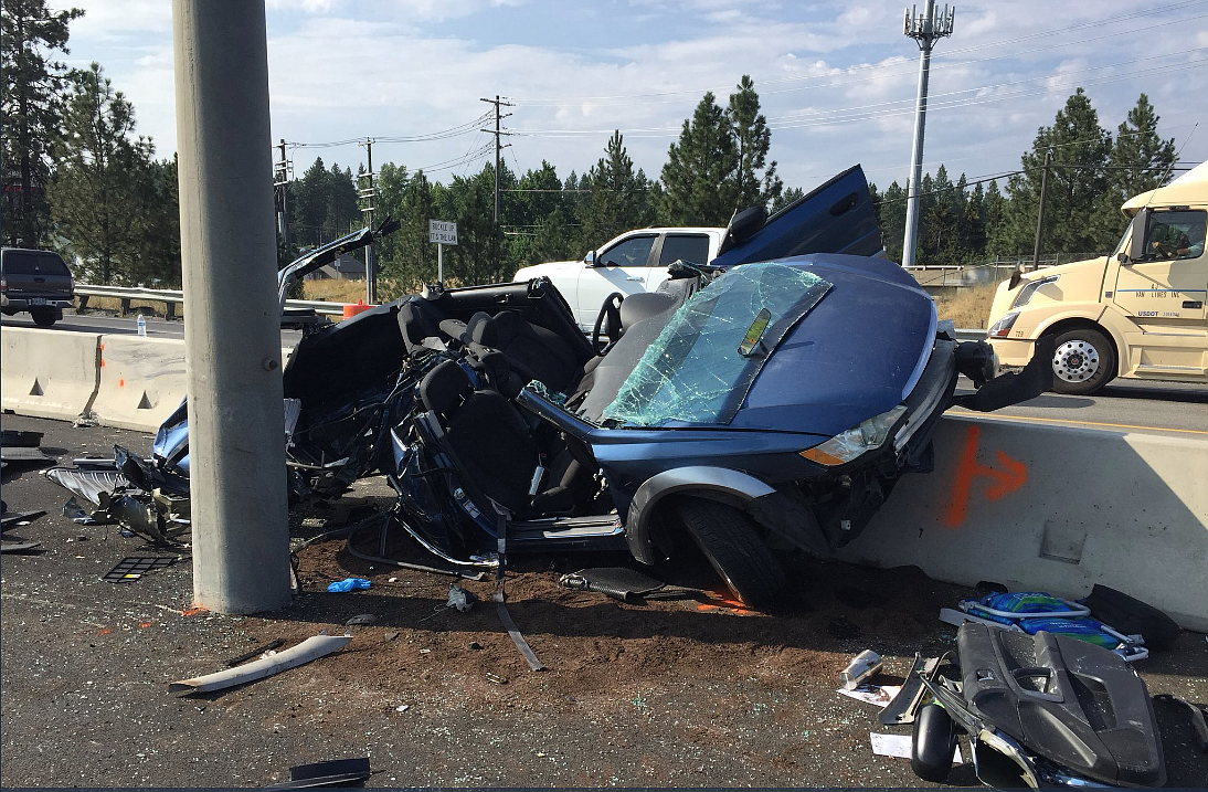 Ellen Brown's vehicle rests atop a concrete barrier in a construction zone on Interstate 90 following a crash believed to be caused by Ian Bolstad. (Photo courtesy of IDAHO STATE POLICE)