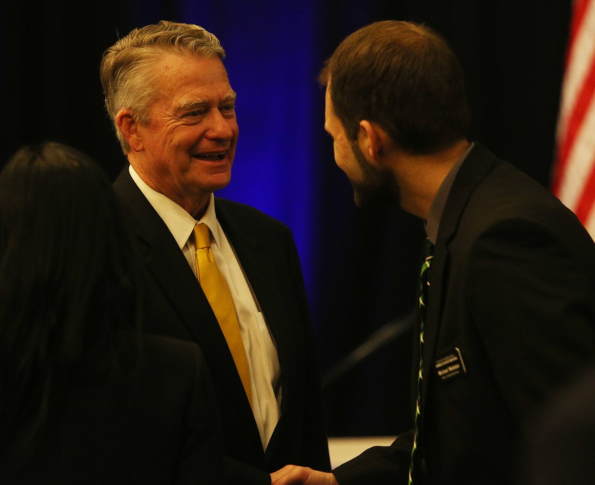 Idaho Gov. Brad Little, left, and Michael Wolsten with Idaho Central Credit Union mingle at the end of the Coeur d&#146;Alene Area Economic Development Corporation&#146;s annual meeting Monday at The Coeur d&#146;Alene Resort.