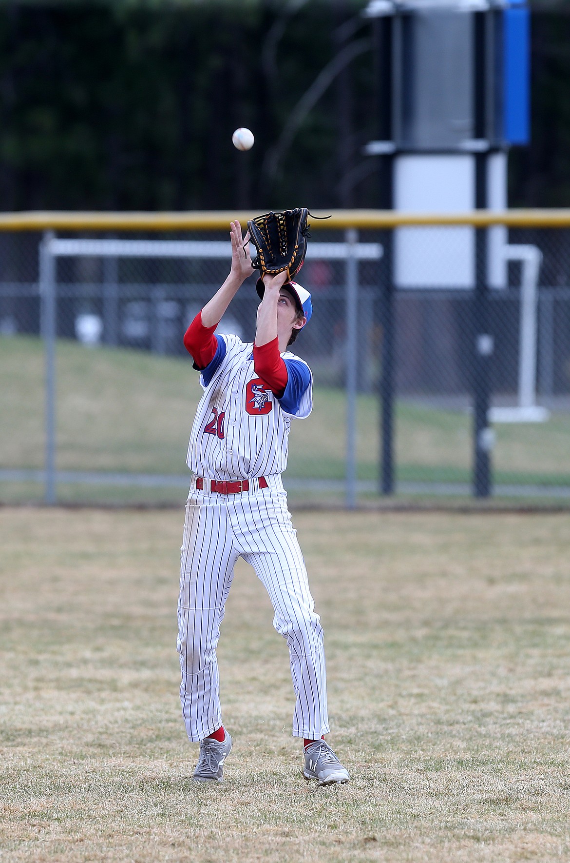 Coeur d&#146;Alene right fielder Alex Karns catches a fly ball for an out in a game against Lakeland.