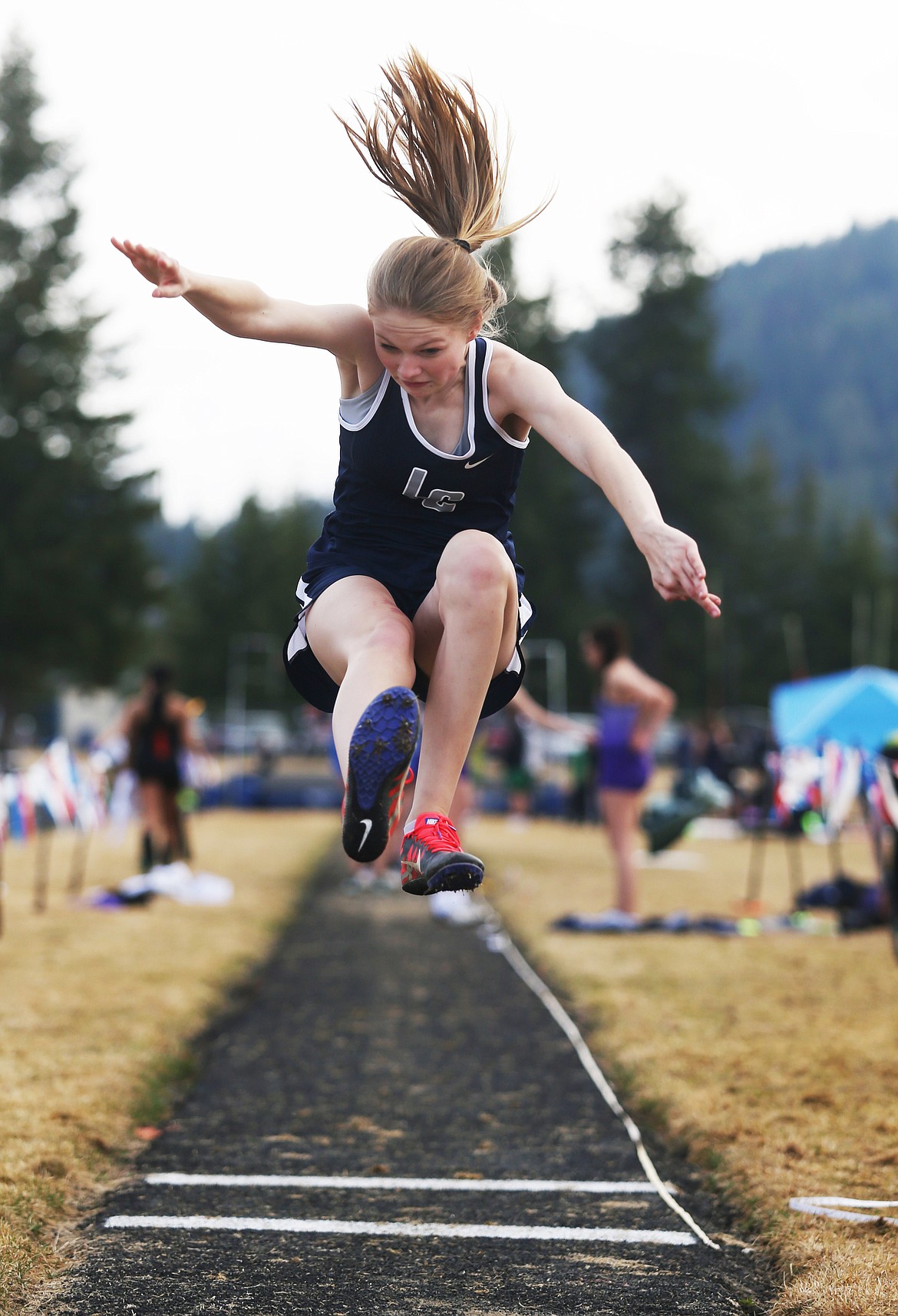 Lake City&#146;s Chloe Butler leaps a distance of 12 feet, 6 inches in the long jump Friday afternoon at the Kootenai County Challege track meet in Spirit Lake. (LOREN BENOIT/Press)