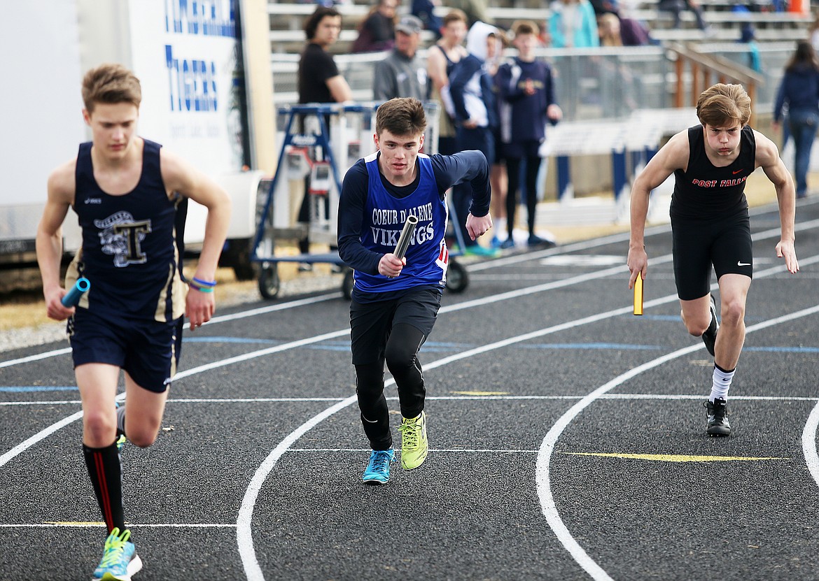 Coeur d&#146;Alene&#146;s Connor Lowder, center, starts the first leg of the 4 x 800 meter relay for the Vikings Friday evening at the Kootenai County Challenge in Spirit Lake. (LOREN BENOIT/Press)