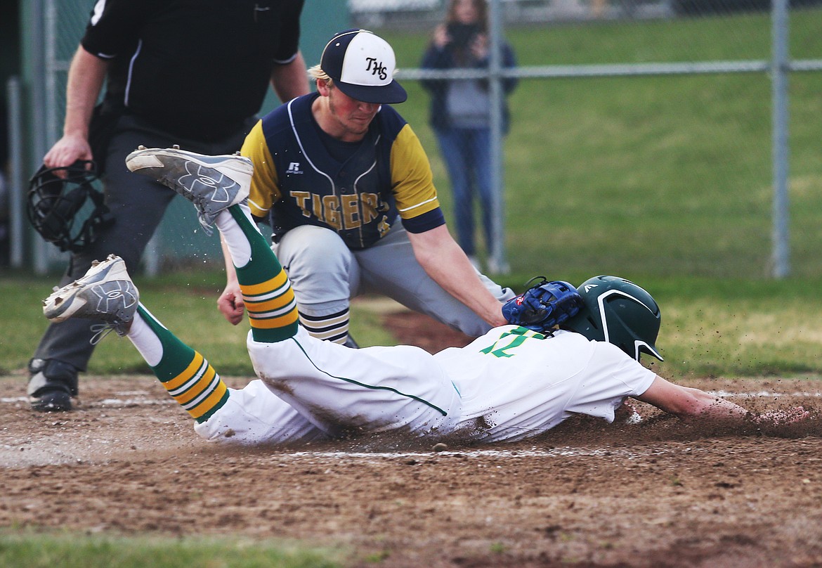 Timberlake&#146;s Alex Drake tags Lakeland baserunner Tristan Clift at home plate for the out in Thursday&#146;s game at Lakeland High School. (LOREN BENOIT/Press)