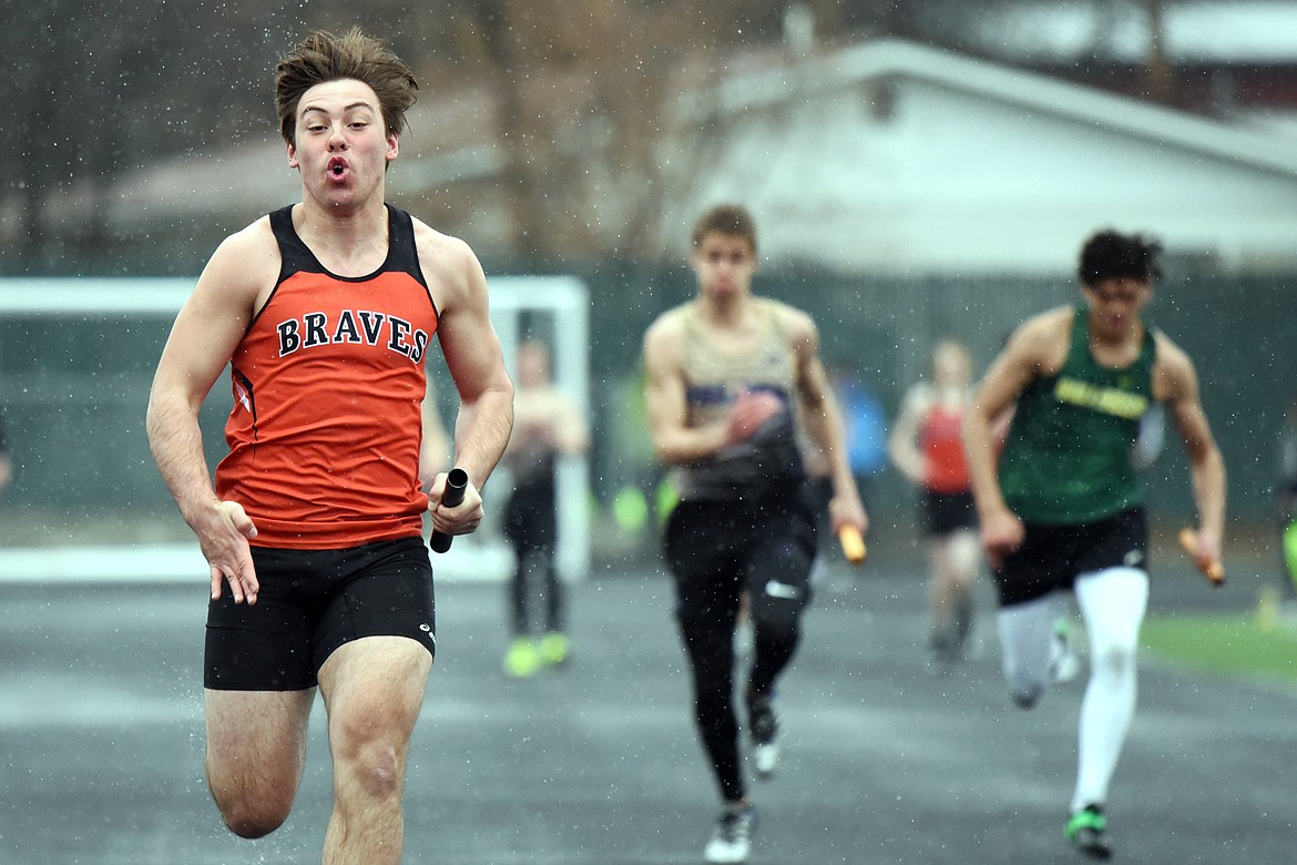 Flathead's Blake Counts secures the victory for the Braves' 4 x 100 relay team at the Flathead Mini Invite at Legends Stadium on Tuesday. (Casey Kreider/Daily Inter Lake)