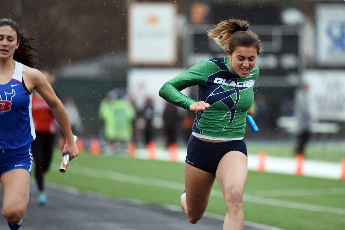 Glacier's Faith Brennan crosses the finish line in the girls' 4 x 100 relay at the Flathead Mini Invite at Legends Stadium on Tuesday. (Casey Kreider/Daily Inter Lake)