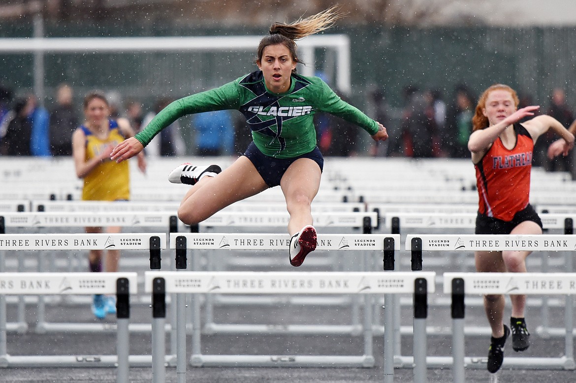 Glacier's Faith Brennan competes in the girls' 100 meter hurdles at the Flathead Mini Invite at Legends Stadium on Tuesday. (Casey Kreider/Daily Inter Lake)