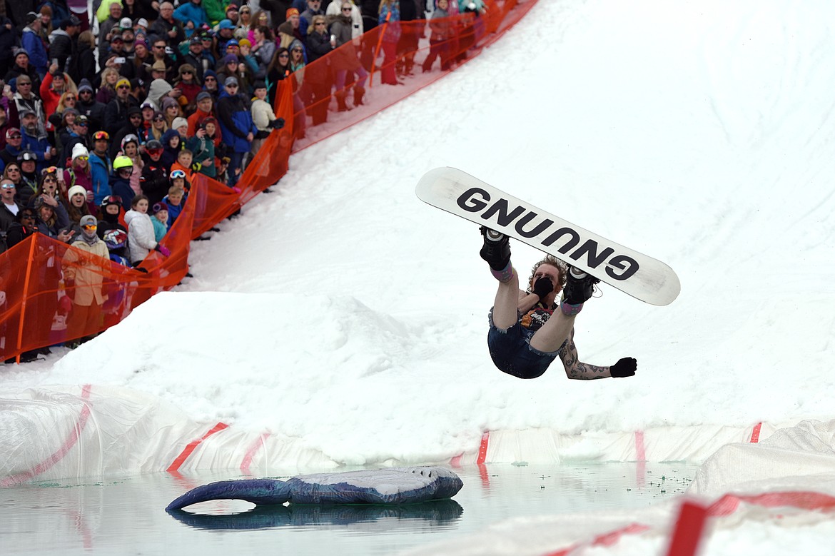 Greg Krudener braces for impact during the 2019 Whitefish Pond Skim at Whitefish Mountain Resort on Saturday. (Casey Kreider/Daily Inter Lake)